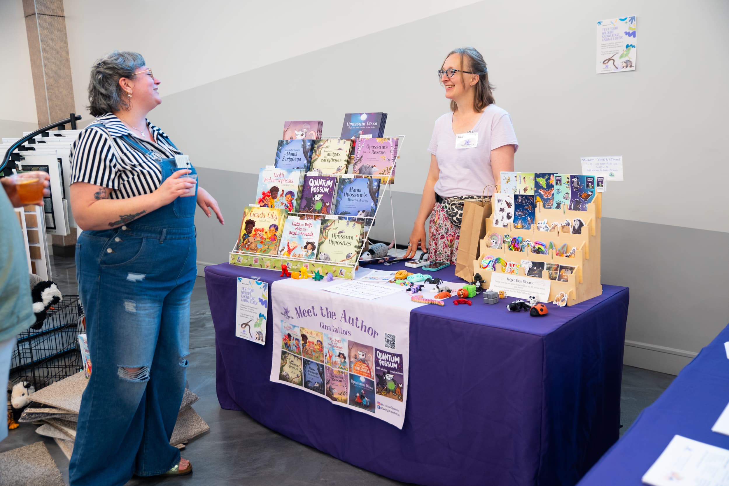 Children's book author at Meet the Author booth at Adopt and Shop community event