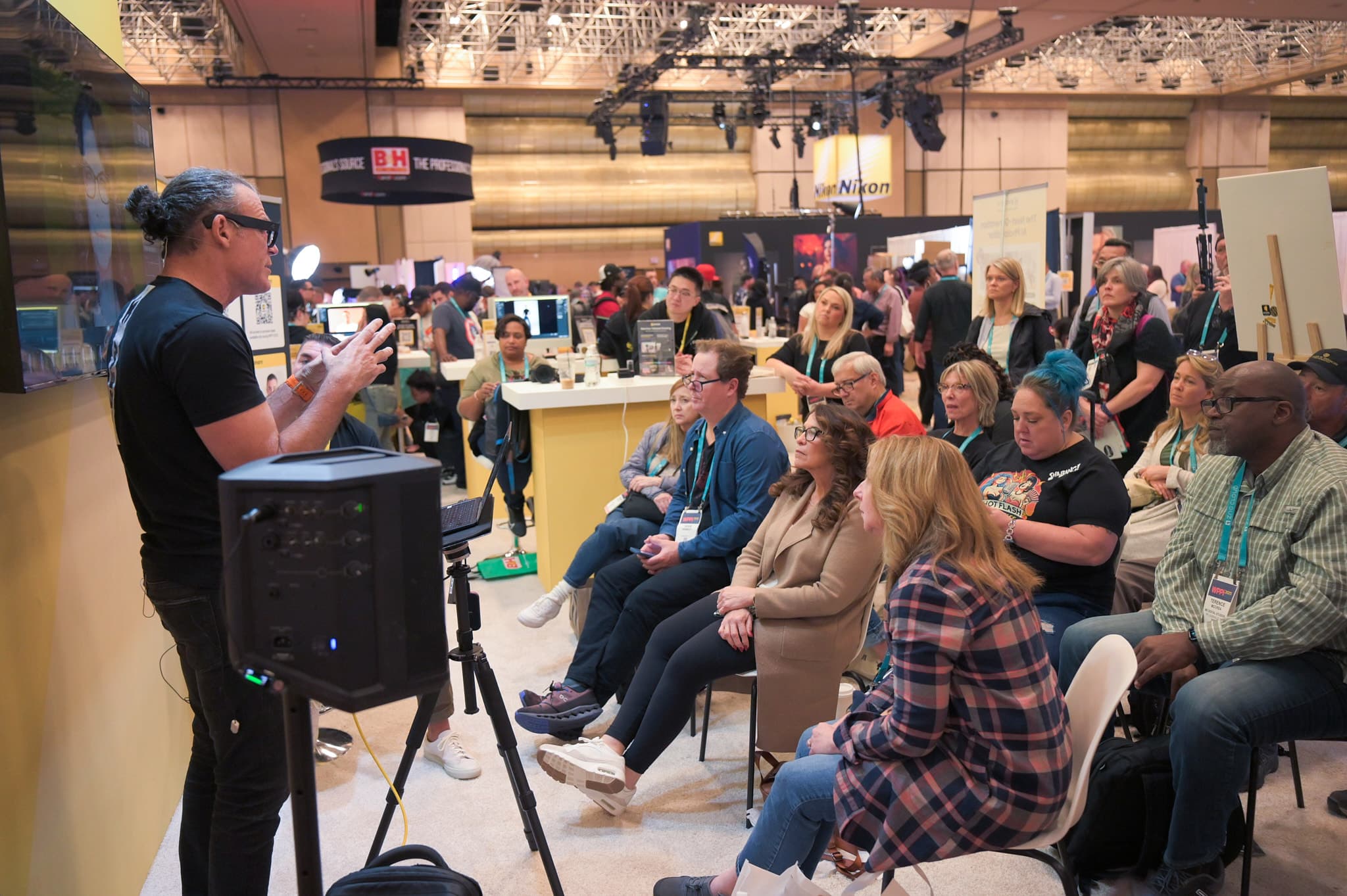 Presenter speaking to engaged audience at WPPI trade show in Las Vegas
