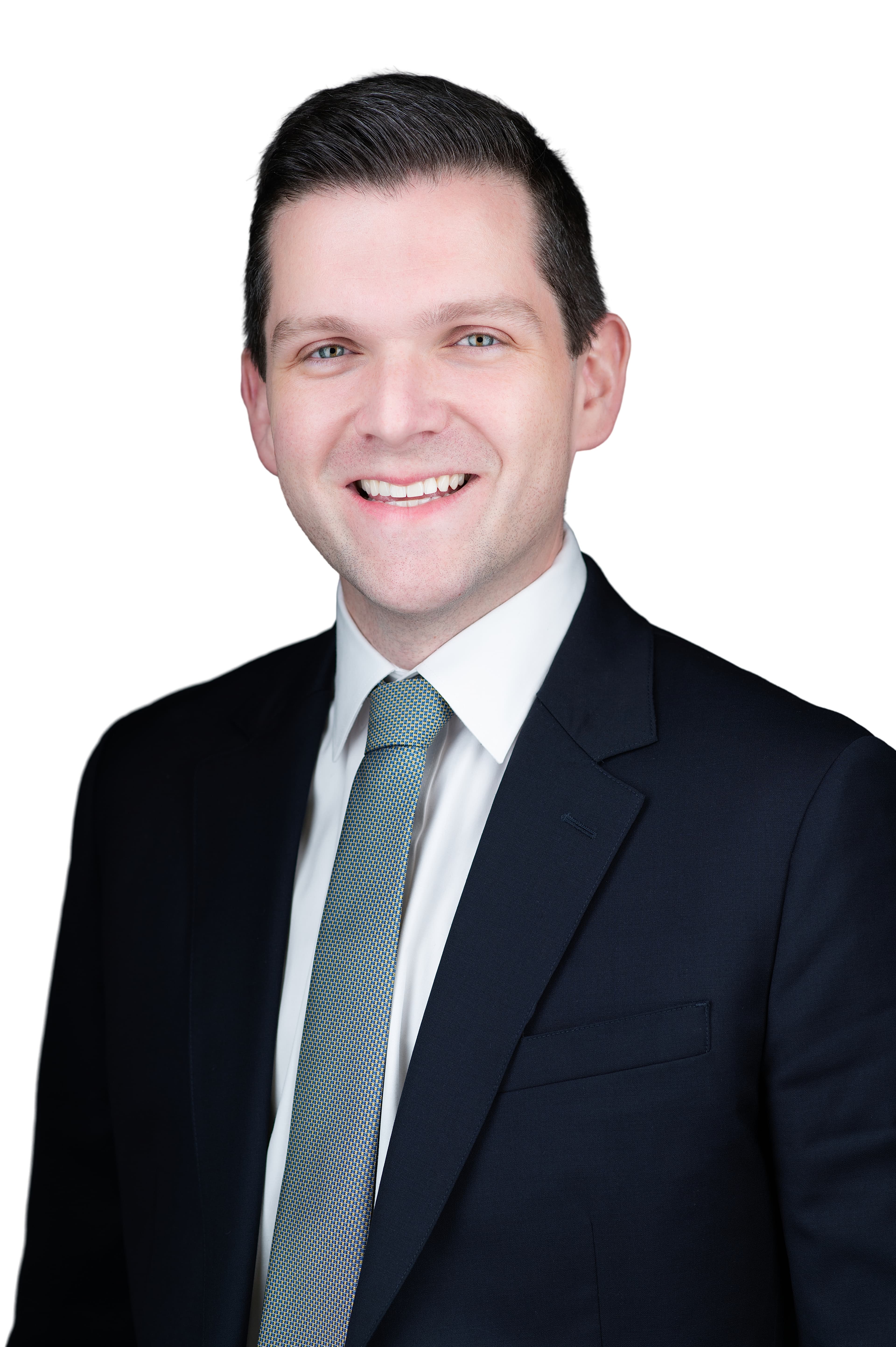 Professional headshot of Daniel Kelly in dark suit and tie on white background — ERAS session result