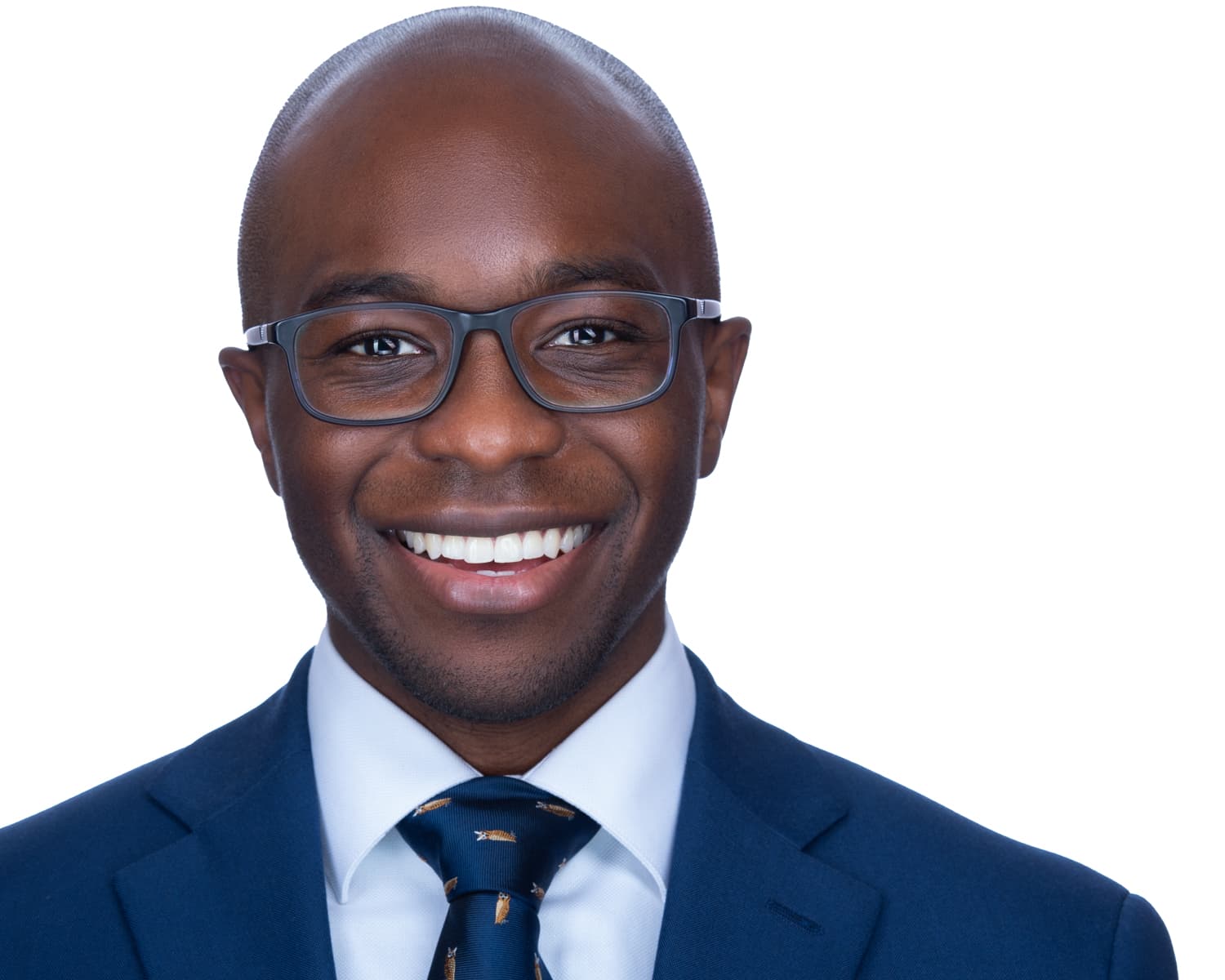 Male medical professional ERAS headshot wearing navy suit and patterned tie on white background